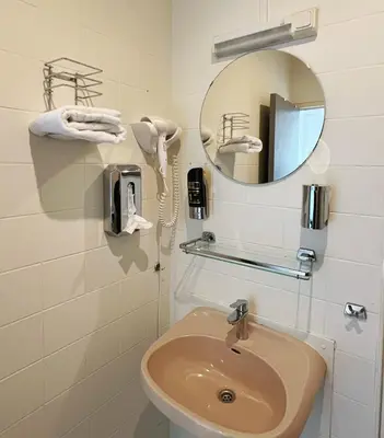 a bathroom with a sink and a mirror at CoronaZeist-Utrecht NL in Zeist