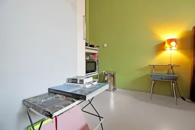 a room with a table with a laptop on it at Eastendroom in Amsterdam