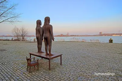a statue of two children standing on a table at Eastendroom in Amsterdam