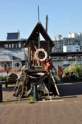 a small wooden bird house with a life preserver on it at Eastendroom in Amsterdam