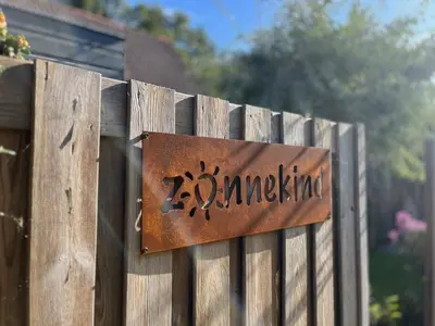 a sign on a fence that reads zimbabwe at 