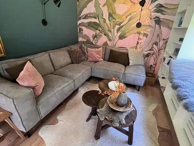 a living room with a couch and a table at 