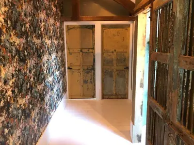 an empty room with a door and a wall at Farmhouse bohemian style close to Amsterdam in Waverveen
