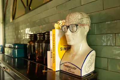 a statue of a head with glasses in a box at Farmhouse bohemian style close to Amsterdam in Waverveen
