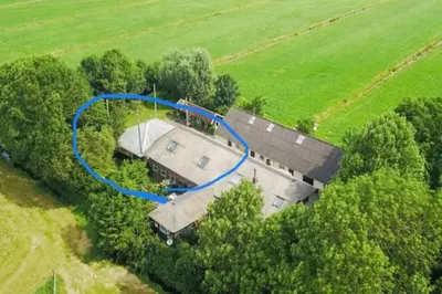 an overhead view of a house with a blue hose at Farmhouse bohemian style close to Amsterdam in Waverveen