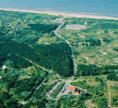 an aerial view of a road next to the beach at Fletcher Boutique Hotel Duinoord in Wassenaar