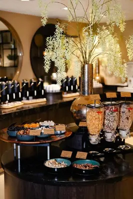a table with plates of food on top at Van der Valk Hotel Akersloot / A9 ALKMAAR in Akersloot