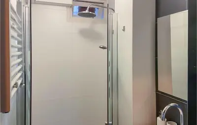 a shower with a glass door in a bathroom at Gorgeous Apartment In Katwijk Aan Zee in Katwijk aan Zee