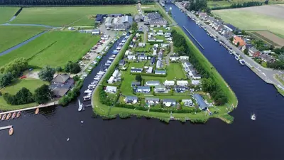 an aerial view of a group of houses on an island in the water at Glamping de Hof van Eeden in Warmond