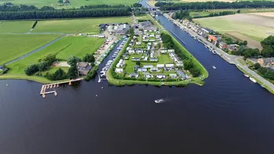 an aerial view of a small island in the water at Glamping de Hof van Eeden in Warmond