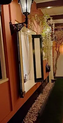 a mirror on the side of a wall next to a hallway at number 8 in Leiden