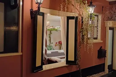 a mirror on the side of a wall at number 8 in Leiden