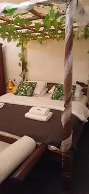 a room with two bunk beds with towels on them at number 8 in Leiden