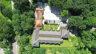 an aerial view of a large house with trees at Hotel Heemskerk in Heemskerk