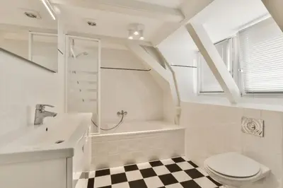a bathroom with a sink and a toilet and a bath tub at Amsterdam Alley Apartment in Amsterdam