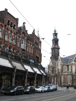 a city street with cars parked in front of buildings at Hotel Galerij in Amsterdam