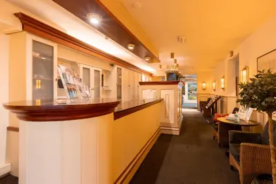 a hallway with a bar in a restaurant at Owl Hotel in Amsterdam