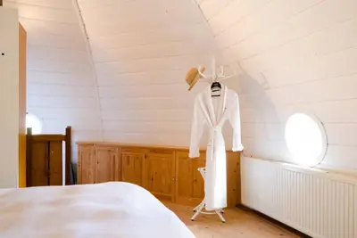 a mannequin wearing a white suit in a room at Historical house on river Vecht in Maarssen