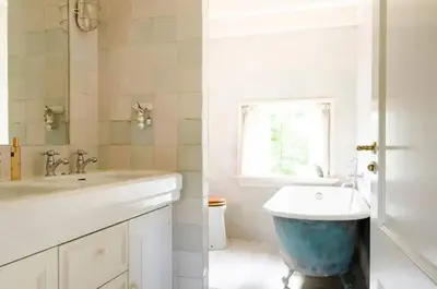 a bathroom with a sink and a bath tub at Historical house on river Vecht in Maarssen