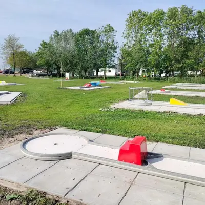 a park with a play park with a playground at Camping de Speld in Nieuwkoop