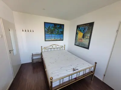 a bedroom with a bed in a room at Sky Home Room 1 in Amsterdam