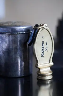 a close up of a silver whistle next to a drum at Suitehotel Posthoorn in Monnickendam