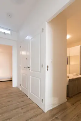 an empty room with a door and a bedroom at Canal House Haarlem in Haarlem