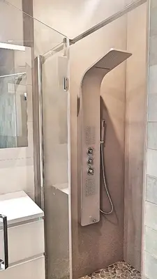 a shower with a glass door in a bathroom at Canal House Haarlem in Haarlem