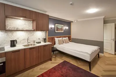 a hotel room with a bed and a sink at Nova Apartments Amsterdam in Amsterdam