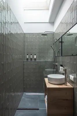 a bathroom with a sink and a shower at Badhuis Hotel in Utrecht