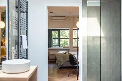 a room with a bed and a window at Badhuis Hotel in Utrecht