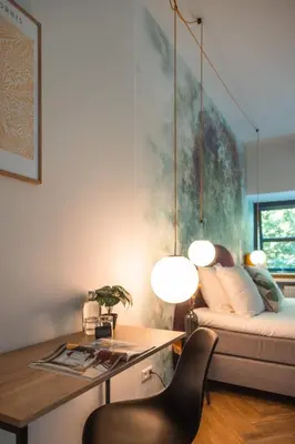 a living room with a table and a couch at Badhuis Hotel in Utrecht