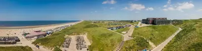 an aerial view of a beach and the ocean at Strandhotel Het Hoge Duin in Wijk aan Zee