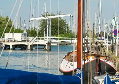 a group of boats docked in a marina at Waterland Vakantiehuis in Monnickendam