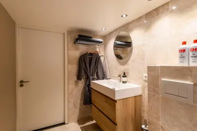 a bathroom with a sink and a mirror at Townhouse 't Raap in Amsterdam