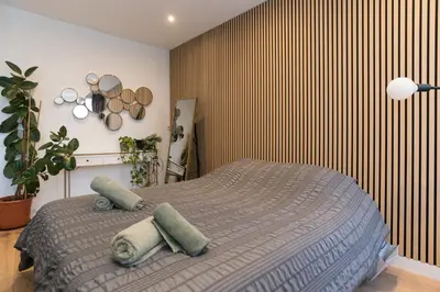 a bedroom with a bed with two pillows on it at Canal view home in the center in Amsterdam