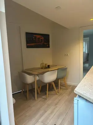 a dining room with a table and two chairs at Lovely tiny house in Zandvoort