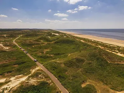 an aerial view of a road next to the beach at Dormio Park Scorleduyn in Schoorl