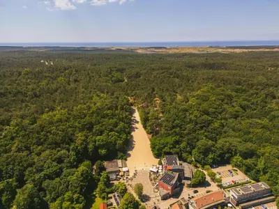 an aerial view of a river running through a forest at Dormio Park Scorleduyn in Schoorl