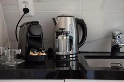 a kitchen counter with a blender on a counter top at Best Neighbourhood Apartment in Amsterdam