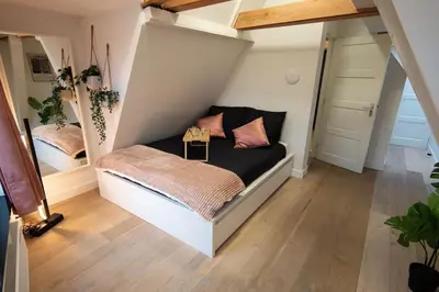 a bedroom with a bed in a room at Best Neighbourhood Apartment in Amsterdam
