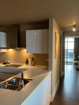 a kitchen with a sink and a counter top at Cala Bassa Beach Boutique Apartments - Sea View in Overveen