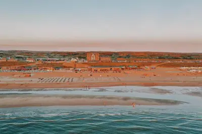 an aerial view of a beach and the ocean at Cala Bassa Beach Boutique Apartments - Sea View in Overveen