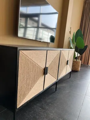 a dresser with a mirror on top of it at Cala Bassa Beach Boutique Apartments - Beach View in Overveen