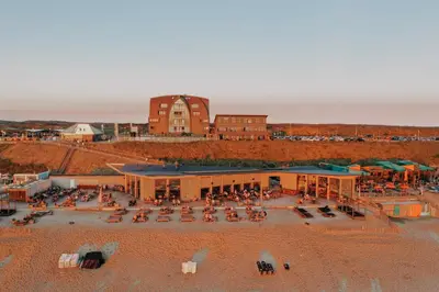 an aerial view of a building on the beach at Cala Bassa Beach Boutique Apartments - Beach View in Overveen