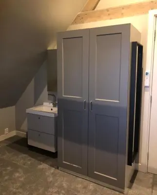 a bathroom with a large cabinet and a sink at welkom bij 5 in Den Ilp