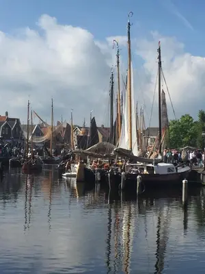 a group of boats are docked in the water at Holiday in Spakenburg Groof in Spakenburg