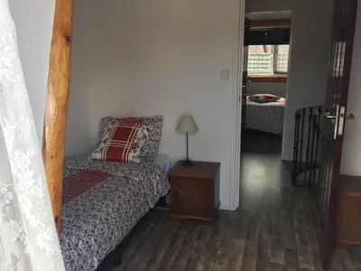 a bedroom with a bed and a table with a lamp at Holiday in Spakenburg Groof in Spakenburg