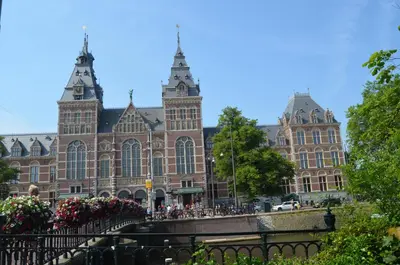 a large brick building with people in front of it at NL Hotel District Leidseplein in Amsterdam