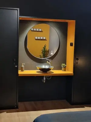 a bathroom with a sink and a mirror at Aan de Burgwal in Enkhuizen